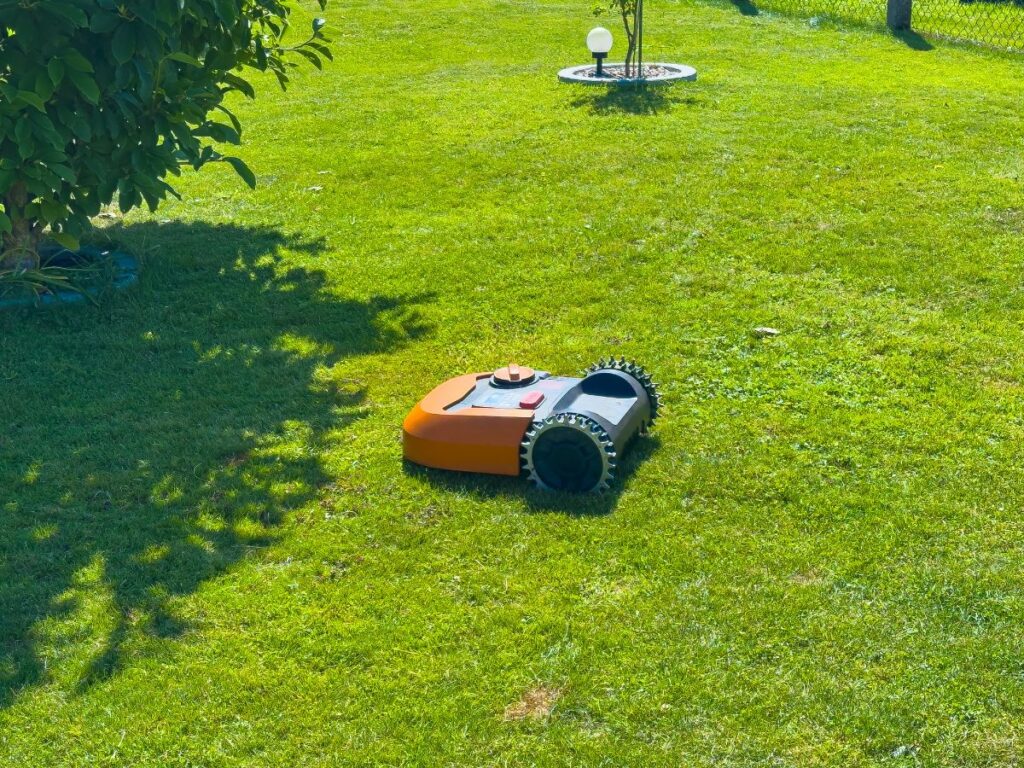 Image of a Robot Lawn Mower on freshly cut lawn.